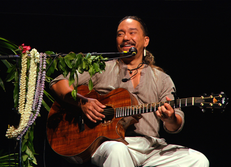 Keali’i Reichel playing a guitar